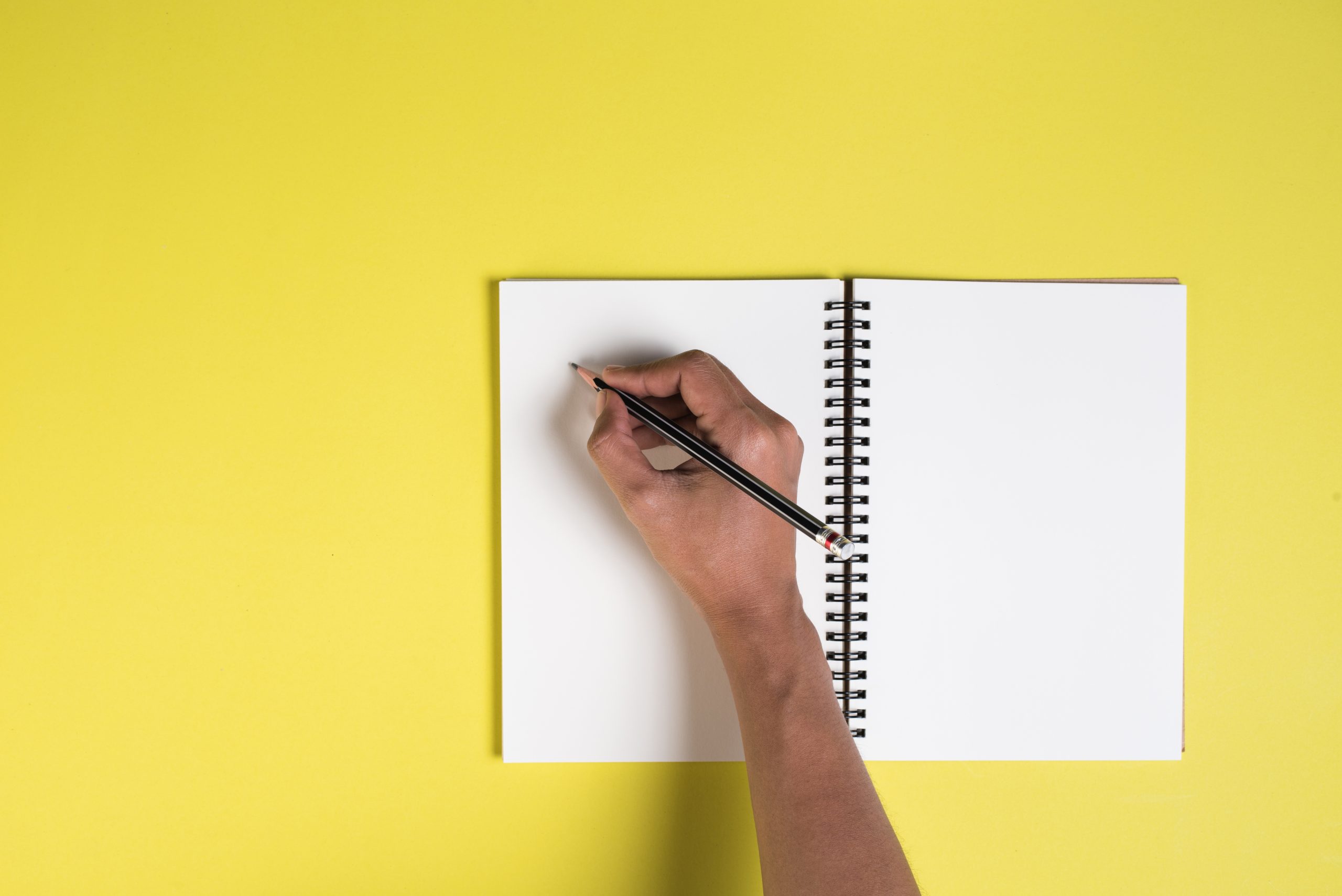 Woman's hands with blank notebook